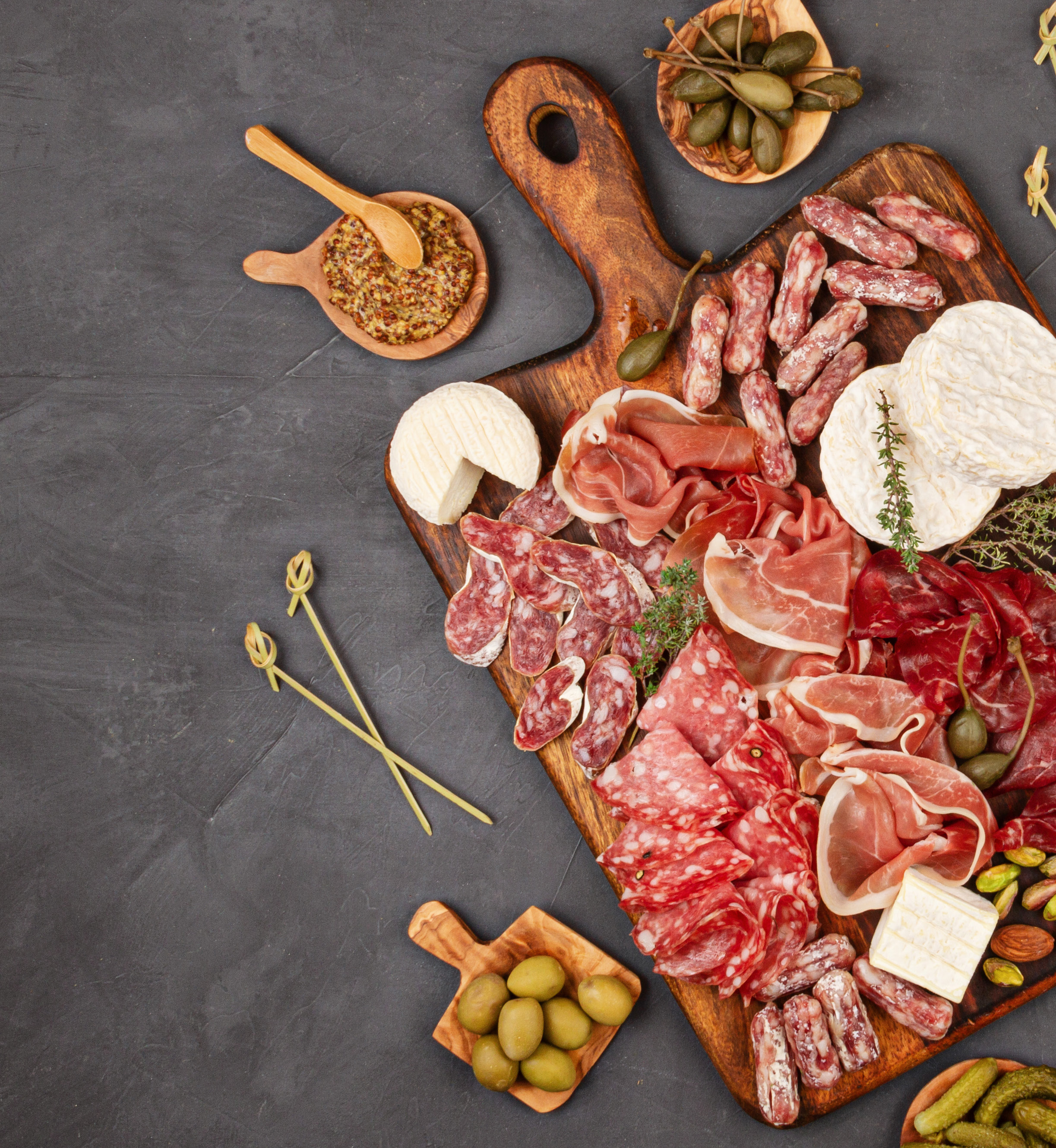 Charcuterie board filled with sliced meats